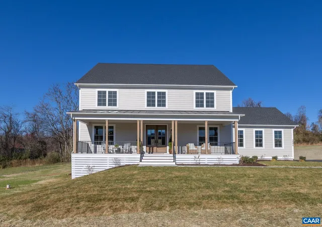 a front view of a house with swimming pool and porch