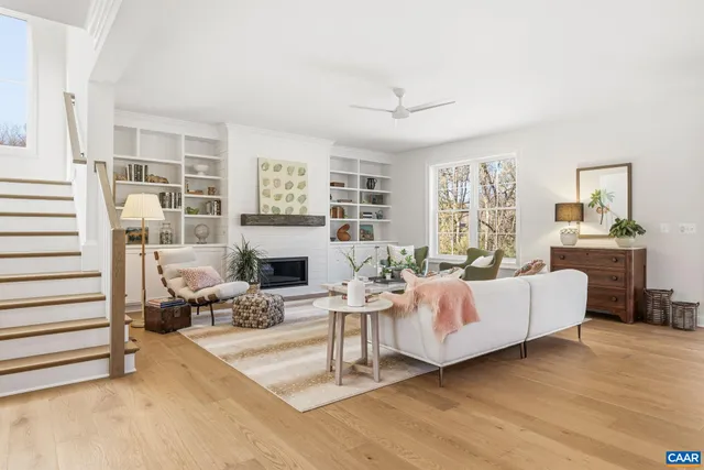 a view of a dining room with furniture and kitchen view