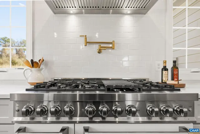 a view of a room with a window and wooden floor