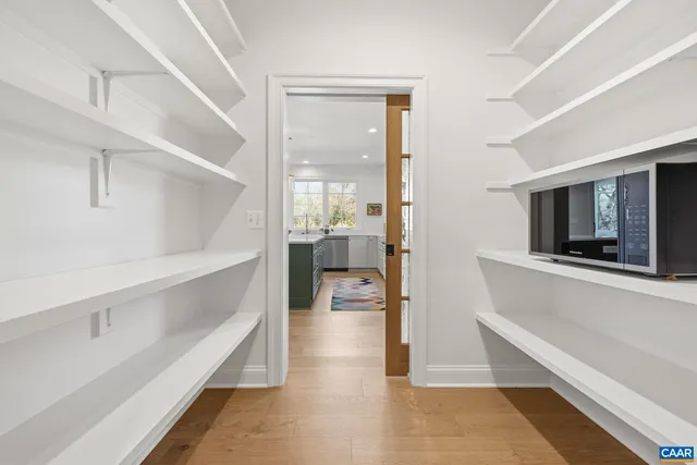 a bathroom with a sink a mirror and a shower
