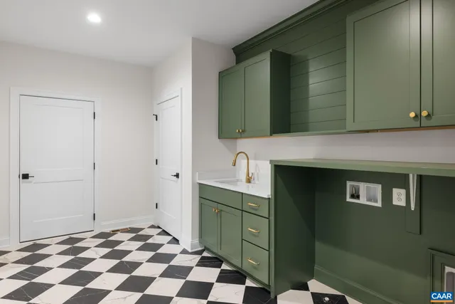 an empty room with an entryway and fan