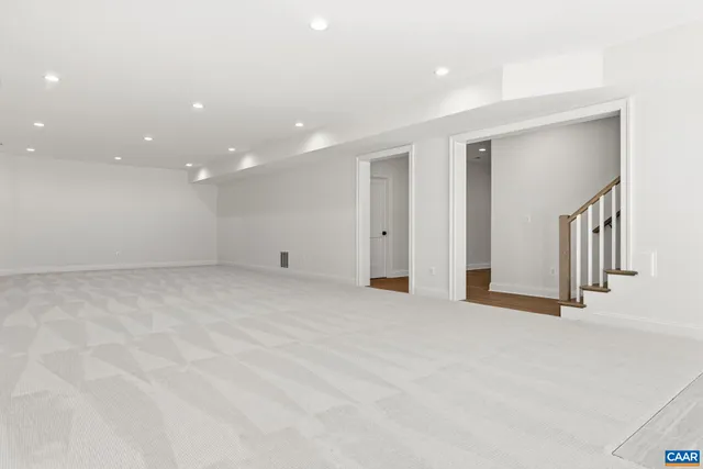 an aerial view of a house with a swimming pool