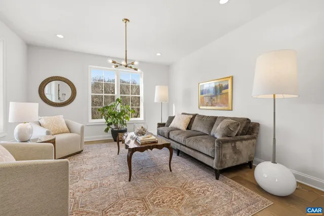 a living room with furniture and a table