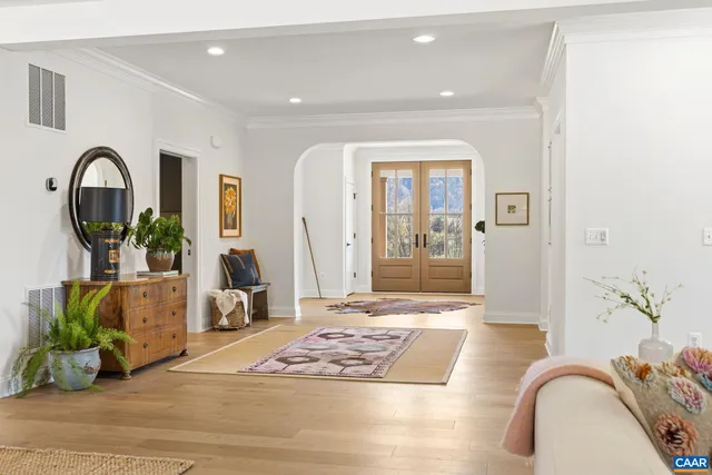 a living room with furniture and a table