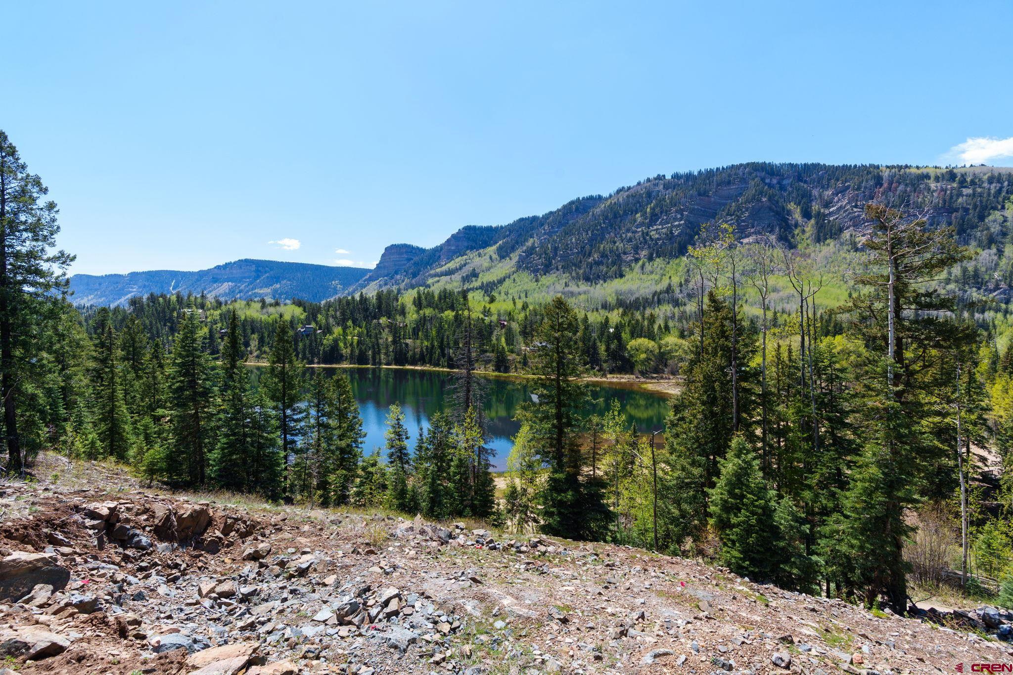 361 Deer Run Way Durango, CO 81301 - Photo 1 of 29 a view of a lake with a mountain in the background