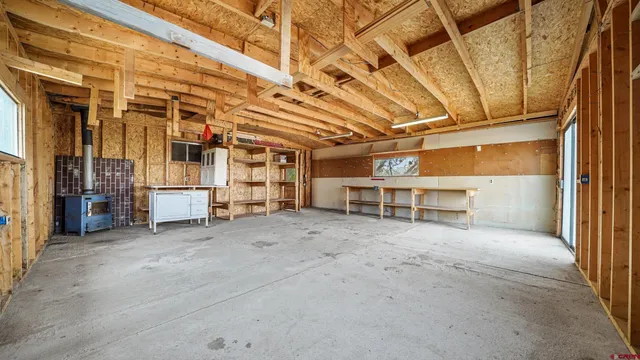 a view of balcony with wooden floor and fence