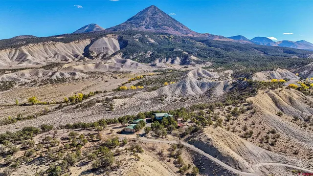 a view of a city with mountains in the background