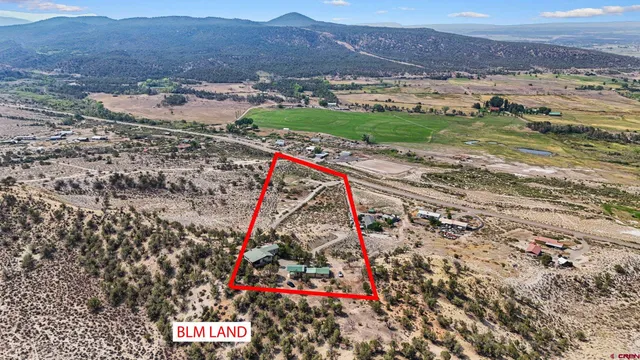 an aerial view of residential building with ocean view