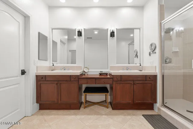 a bathroom with a sink double vanity and a mirror