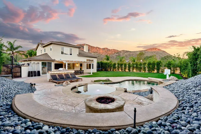 an outdoor space with furniture and garden