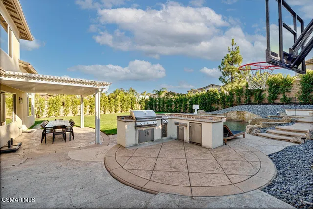 a view of a swimming pool with outdoor seating