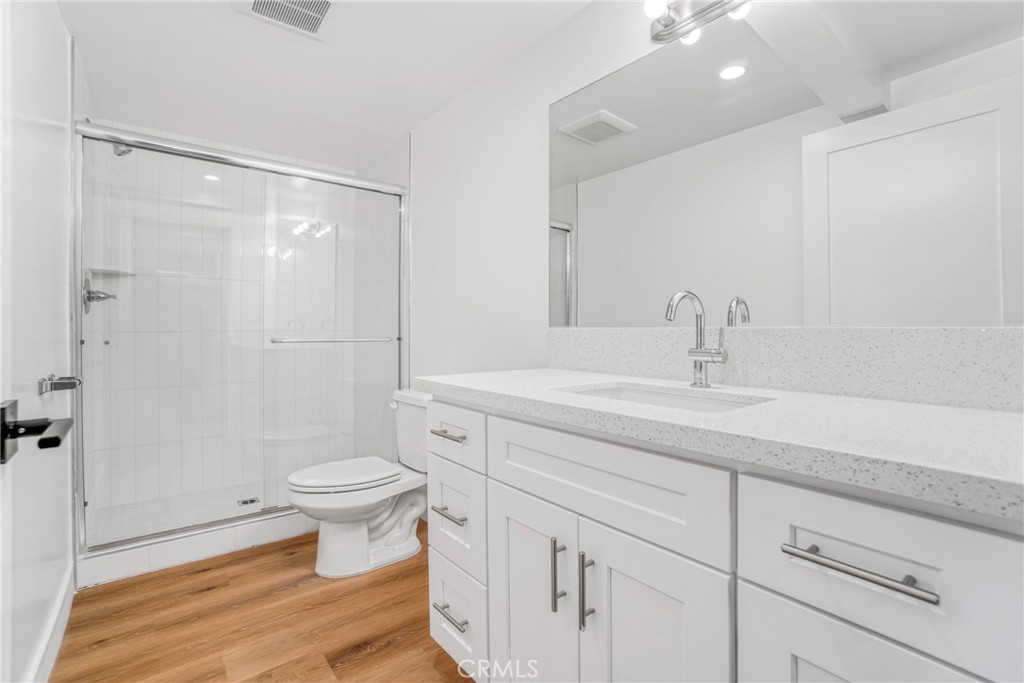 221 Sheldon Street El Segundo, CA 90245 - Photo 13 of 34 a bathroom with a sink toilet a mirror and shower