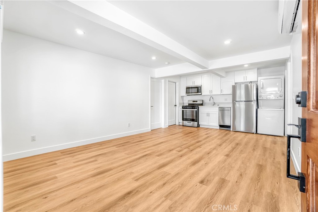221 Sheldon Street El Segundo, CA 90245 - Photo 4 of 34 a view of a kitchen with a sink and a refrigerator