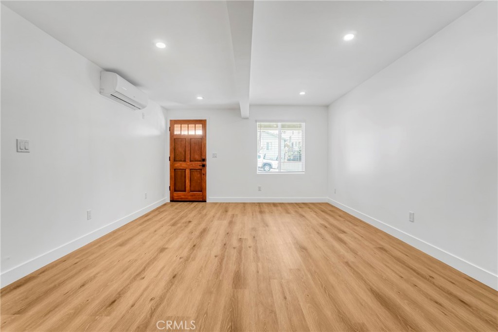 221 Sheldon Street El Segundo, CA 90245 - Photo 6 of 34 wooden floor in an empty room with a window
