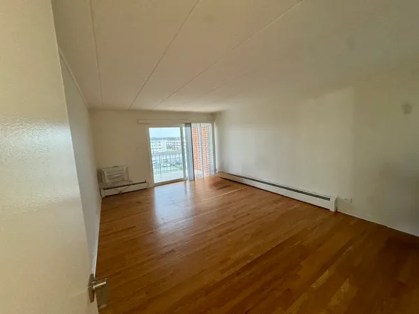 a room with furniture and wooden floor