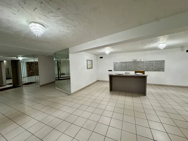 a view of a living room and kitchen view