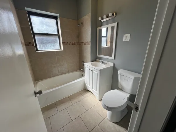 a bathroom with a sink a toilet and a bathtub