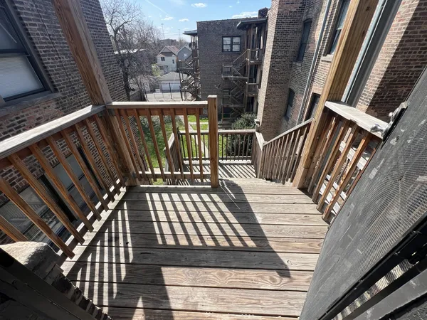 a view of balcony with wooden floor