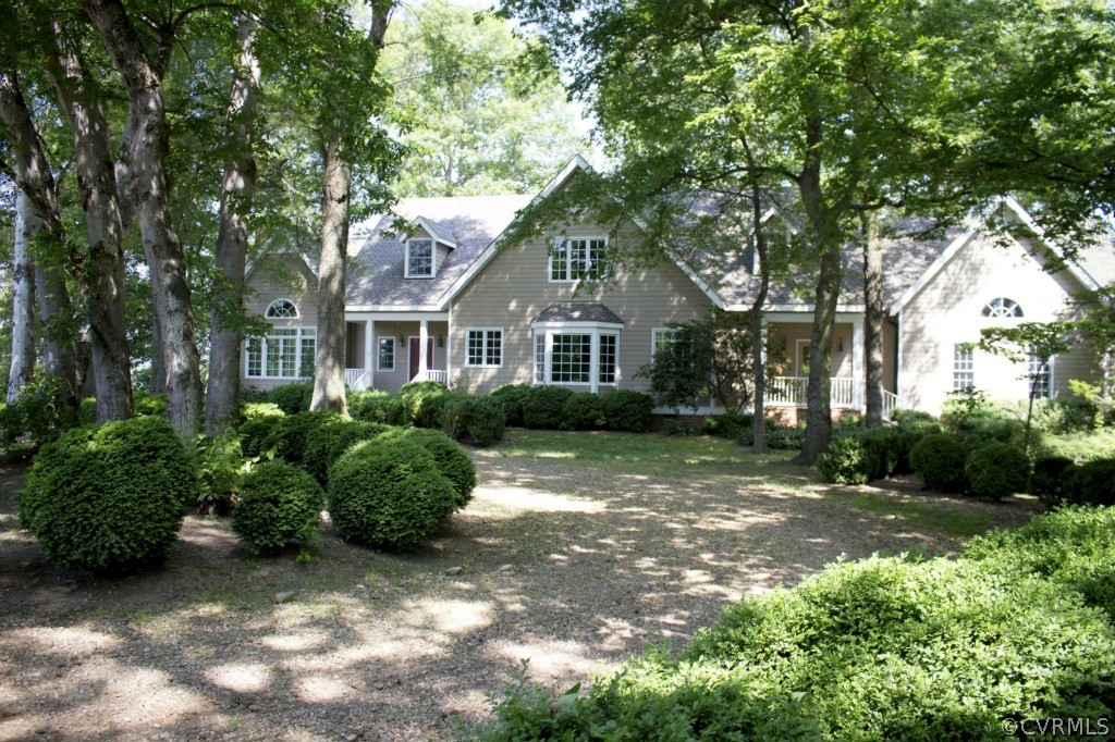 812 Shirley Plantation Road Charles City, VA 23030 - Photo 1 of 24 a front view of a house with a garden