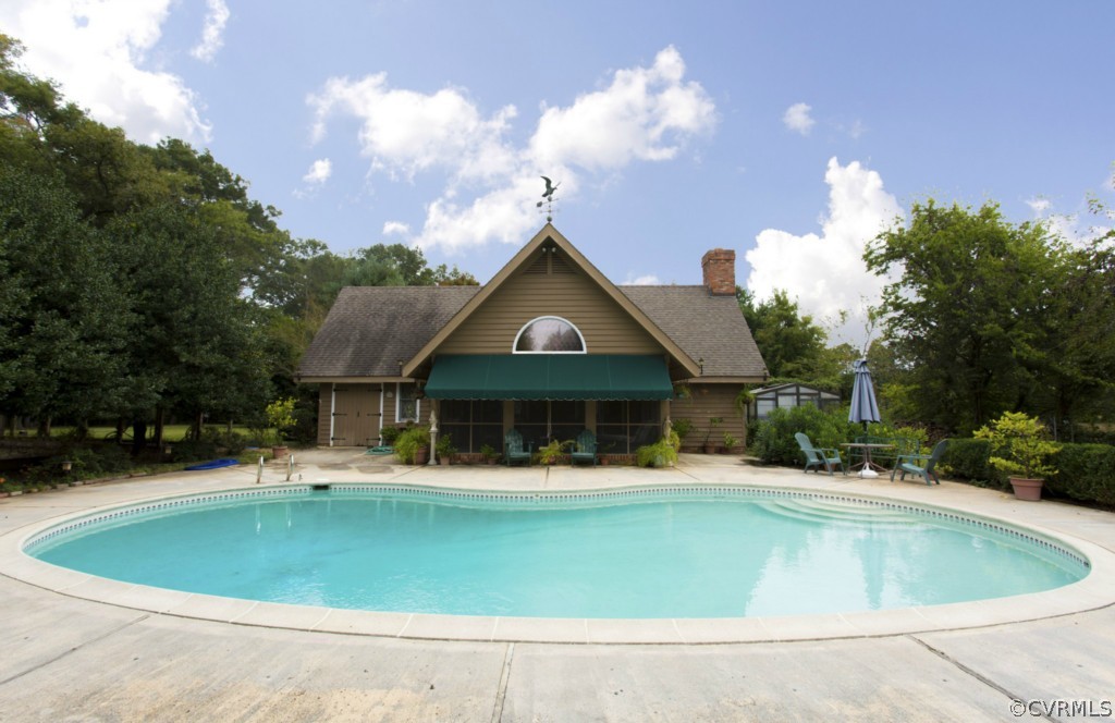 812 Shirley Plantation Road Charles City, VA 23030 - Photo 16 of 24 a front view of the house with yard and swimming pool