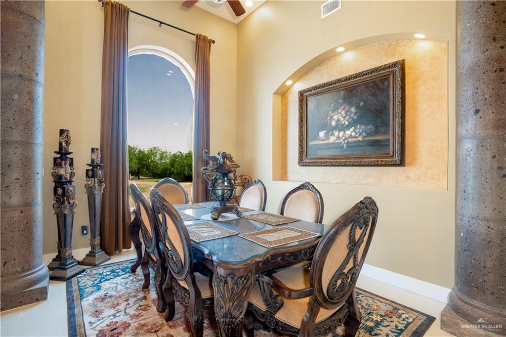 1627 South Midway Road Donna, TX 78537 - Photo 11 of 36 a view of a dining room with furniture and wooden floor