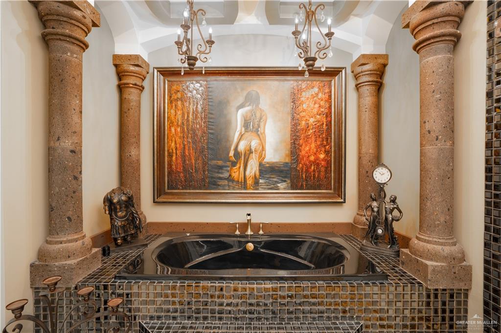 1627 South Midway Road Donna, TX 78537 - Photo 14 of 36 a bathroom with a sink a mirror and shower