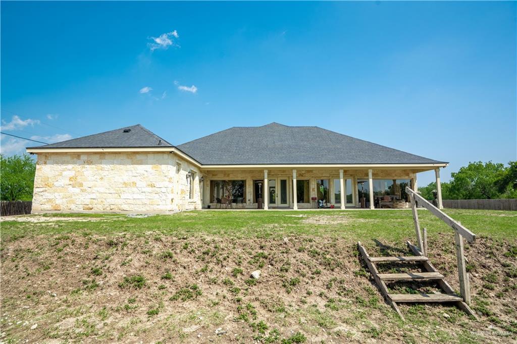 1627 South Midway Road Donna, TX 78537 - Photo 19 of 36 a front view of a house with a yard
