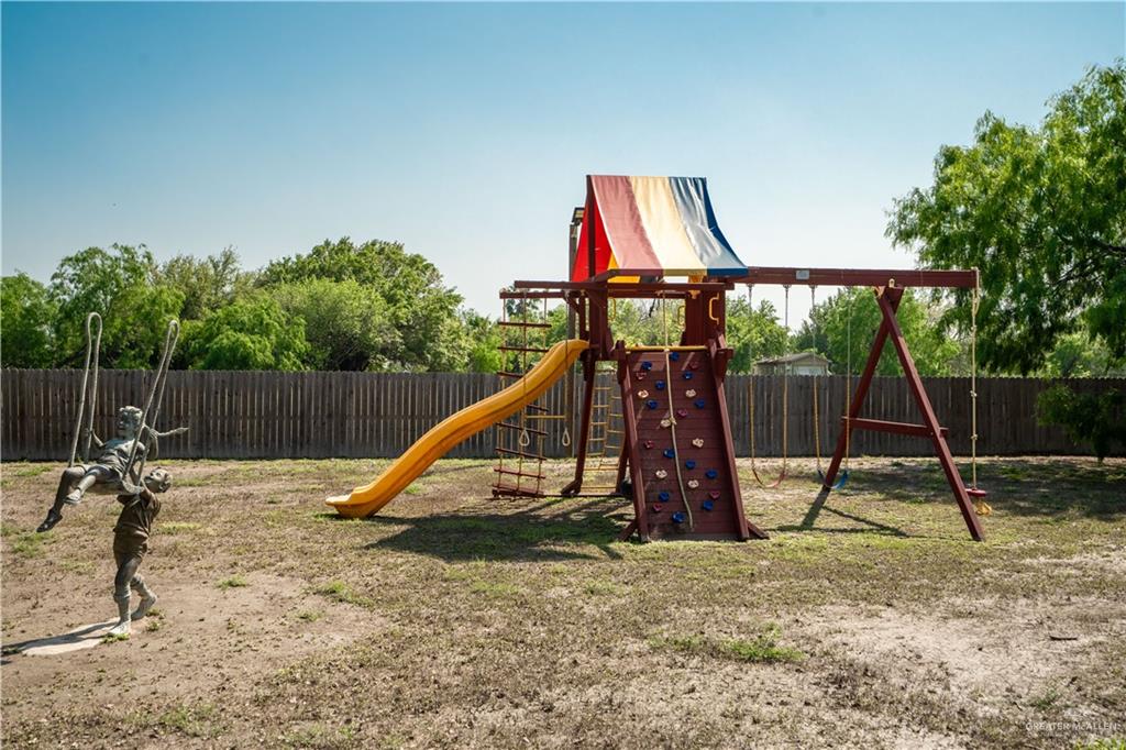1627 South Midway Road Donna, TX 78537 - Photo 23 of 36 a view of outdoor space with a slide