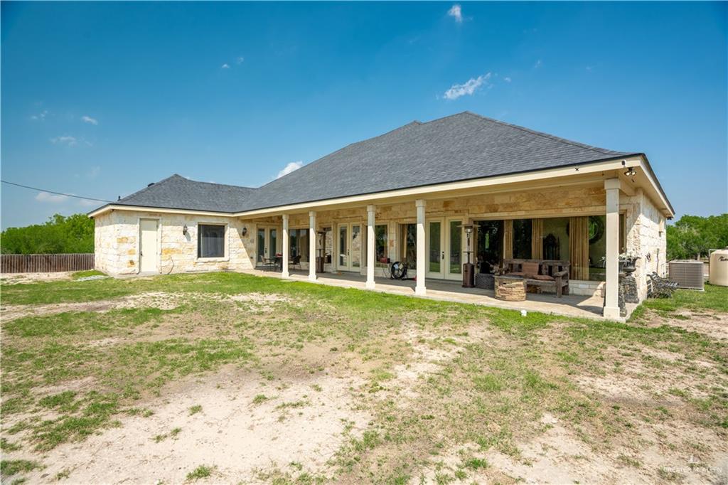 1627 South Midway Road Donna, TX 78537 - Photo 26 of 36 a front view of a house with a yard