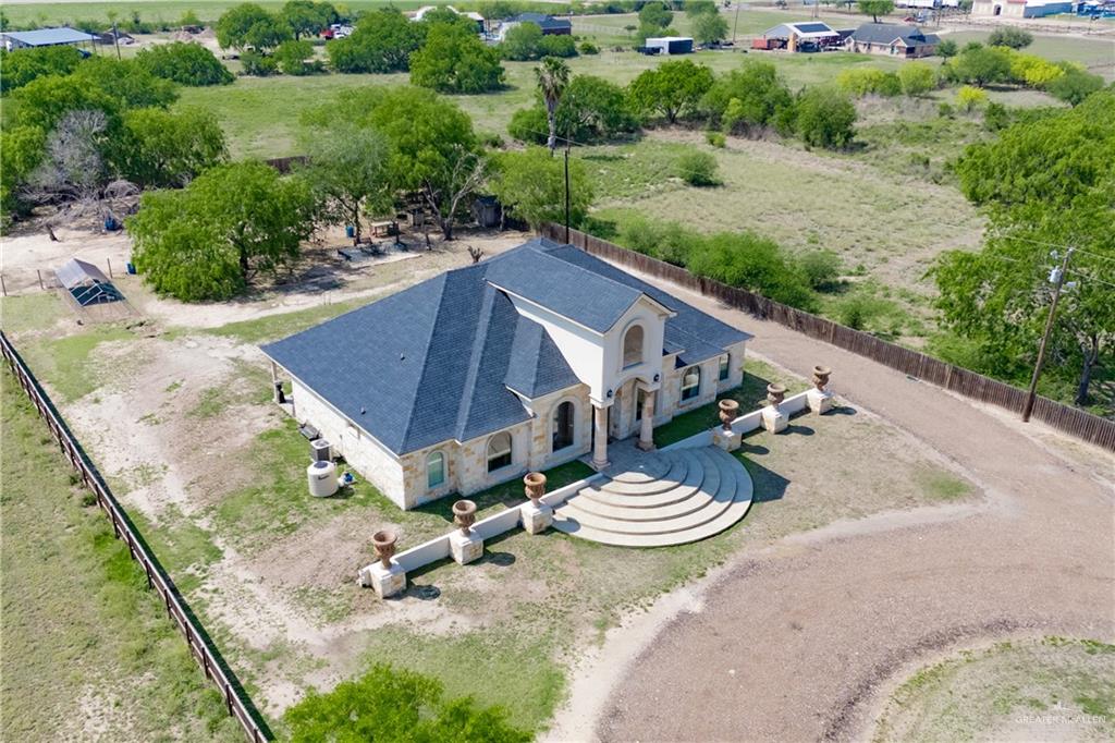 1627 South Midway Road Donna, TX 78537 - Photo 27 of 36 an aerial view of a house with table and chairs