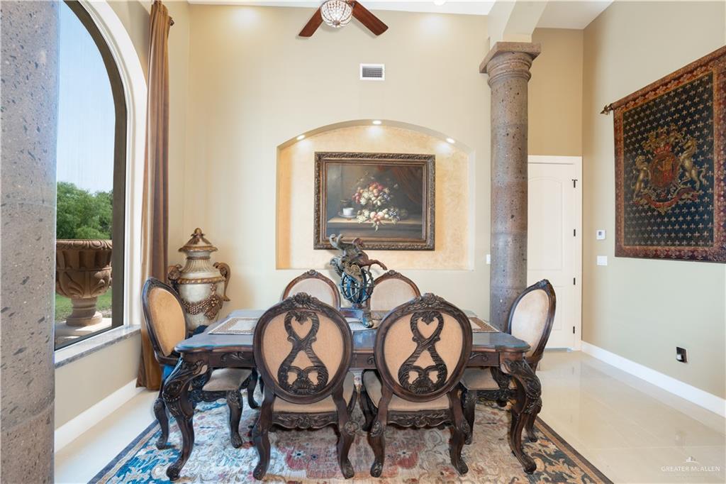 1627 South Midway Road Donna, TX 78537 - Photo 4 of 36 a view of a dining room with furniture and a window