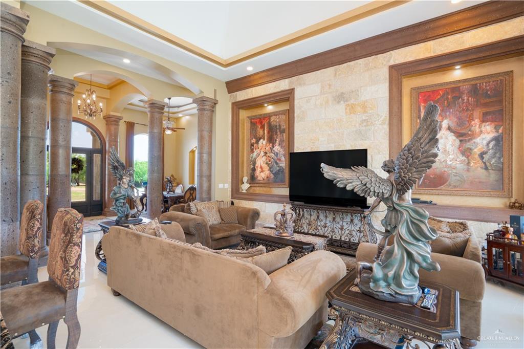 1627 South Midway Road Donna, TX 78537 - Photo 6 of 36 a living room with furniture and a flat screen tv