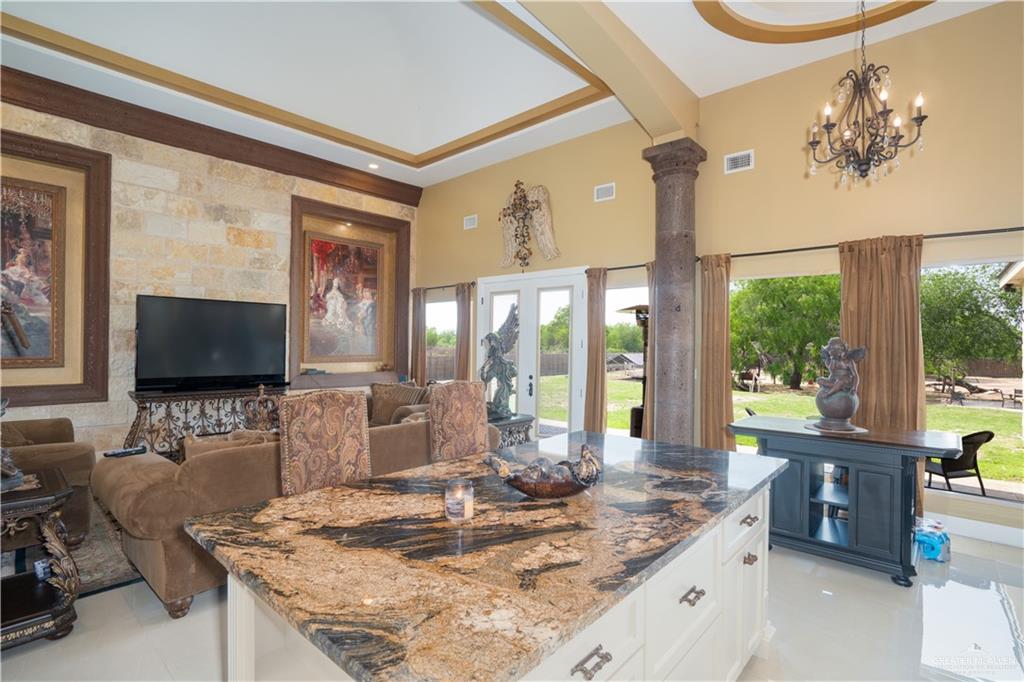 1627 South Midway Road Donna, TX 78537 - Photo 7 of 36 a living room with fireplace furniture and a flat screen tv