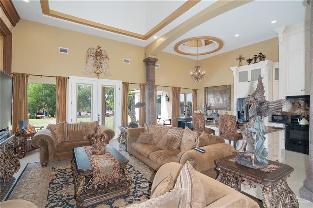 1627 South Midway Road Donna, TX 78537 - Photo 8 of 36 a living room with furniture and a large window