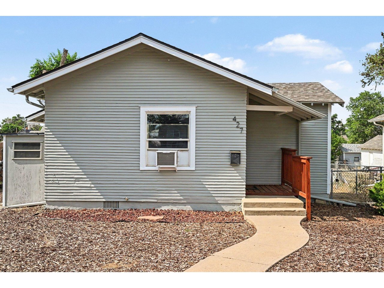 427 9th Street Greeley, CO 80631 - Photo 2 of 22 a backyard of a house