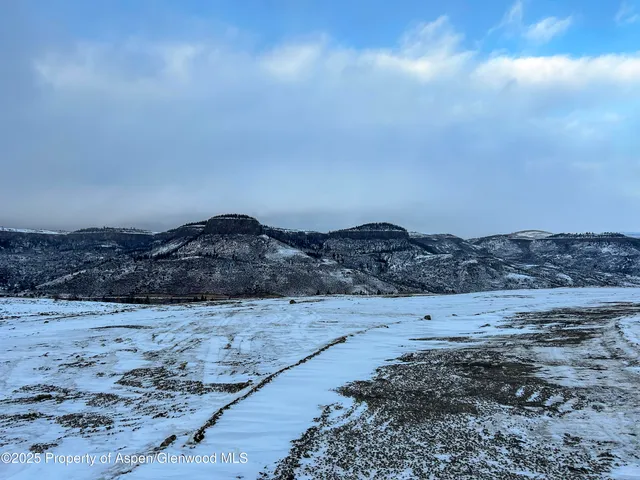 a view of ocean and mountain