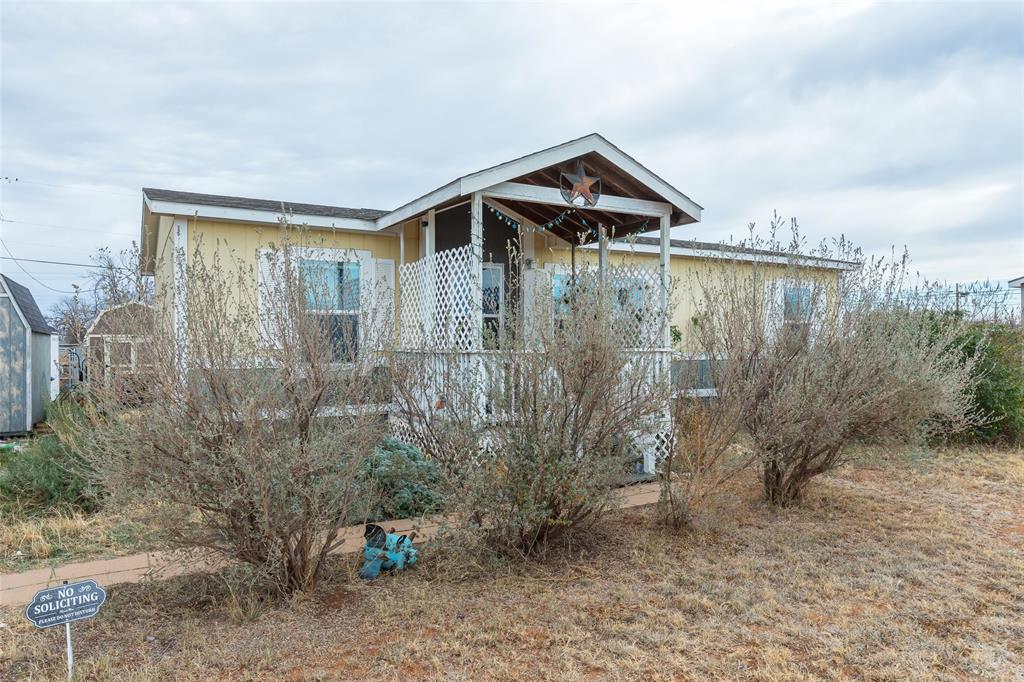 308 Marion Street Merkel, TX 79536 - Photo 17 of 20 a front view of a house with a yard