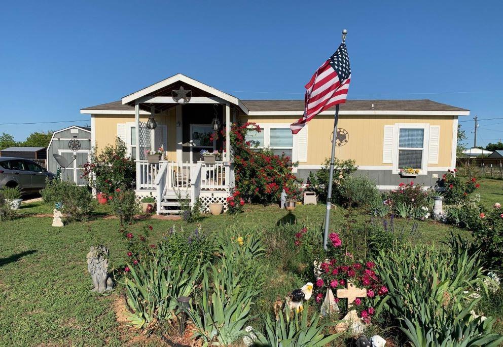 308 Marion Street Merkel, TX 79536 - Photo 2 of 20 a front view of a house with a yard
