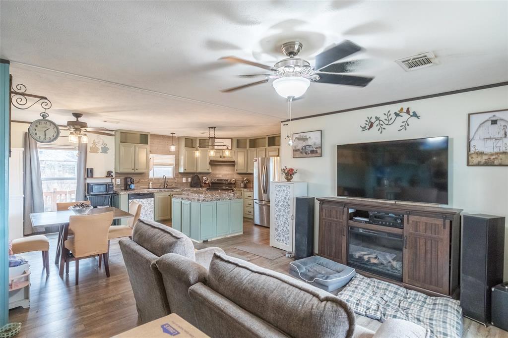 308 Marion Street Merkel, TX 79536 - Photo 9 of 20 a living room with furniture and a flat screen tv