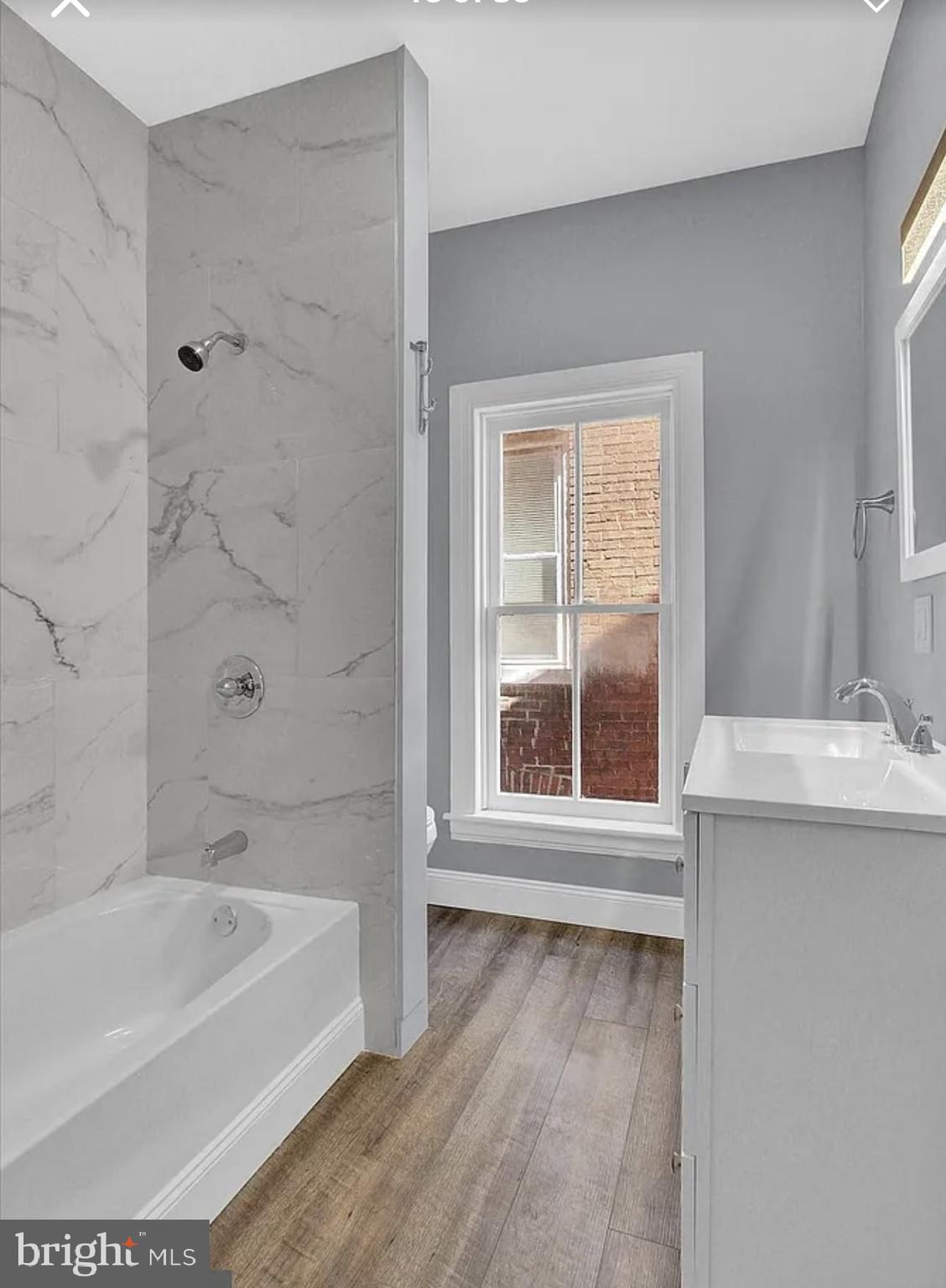 56 North Main Street Spring Grove, PA 17362 - Photo 14 of 25 a bathroom with a bathtub and a sink