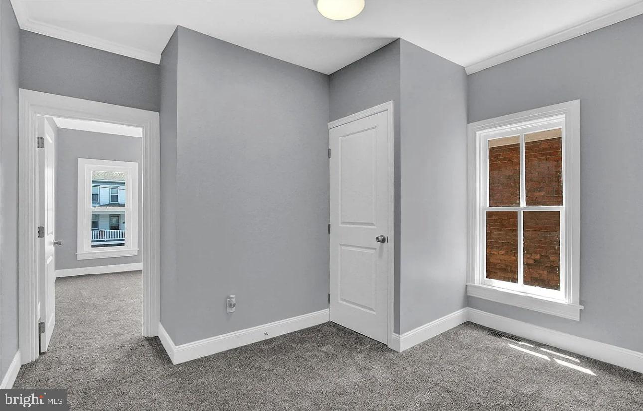 56 North Main Street Spring Grove, PA 17362 - Photo 19 of 25 an empty room with windows and closet