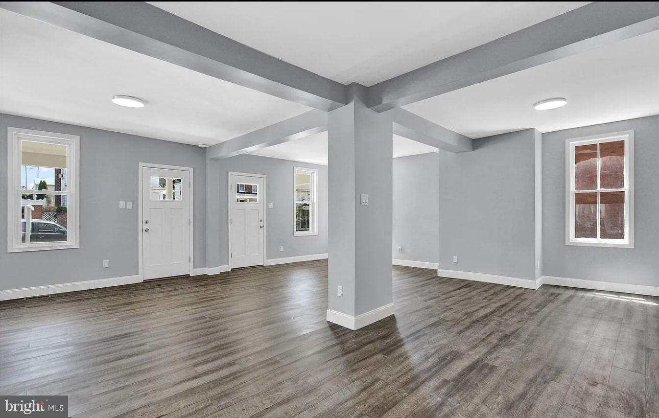 56 North Main Street Spring Grove, PA 17362 - Photo 2 of 25 an empty room with wooden floor and windows