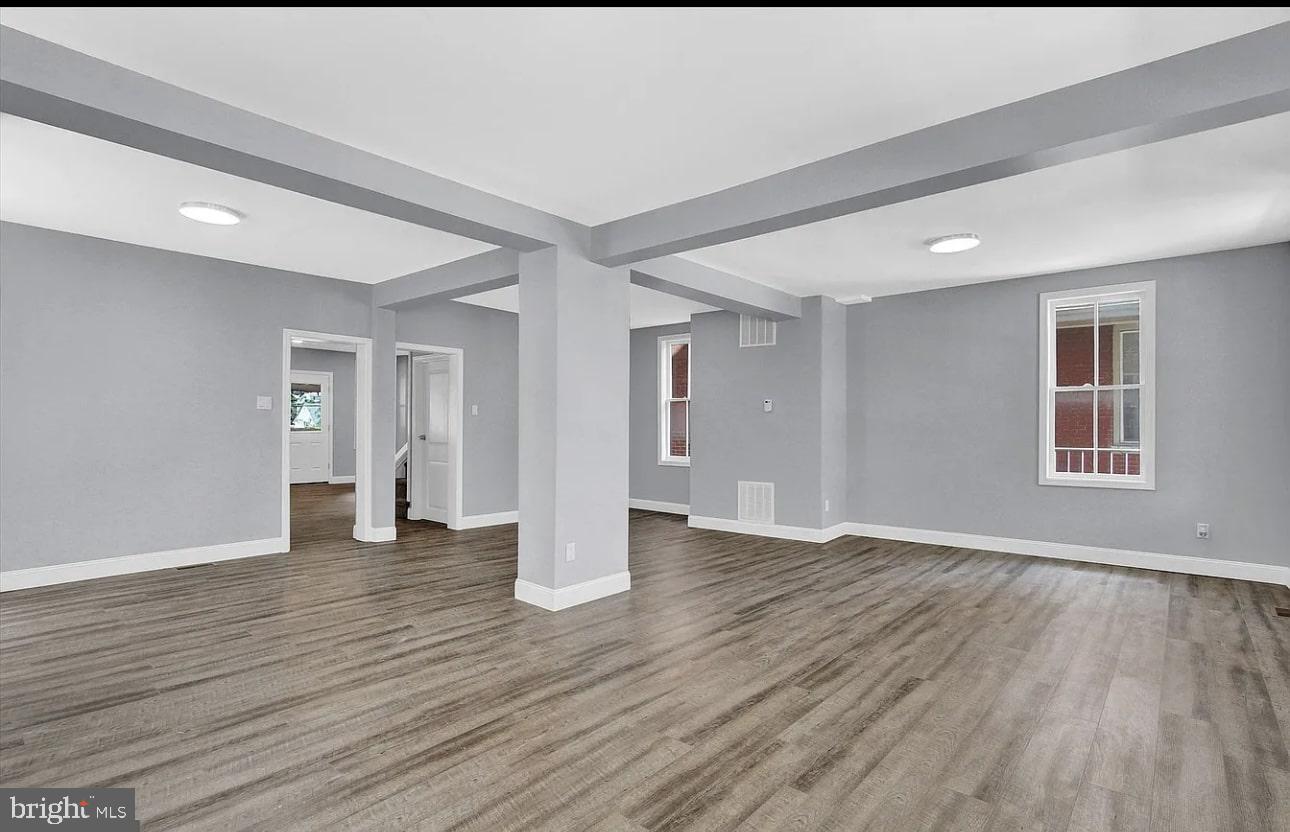 56 North Main Street Spring Grove, PA 17362 - Photo 4 of 25 a view of an empty room with wooden floor and windows