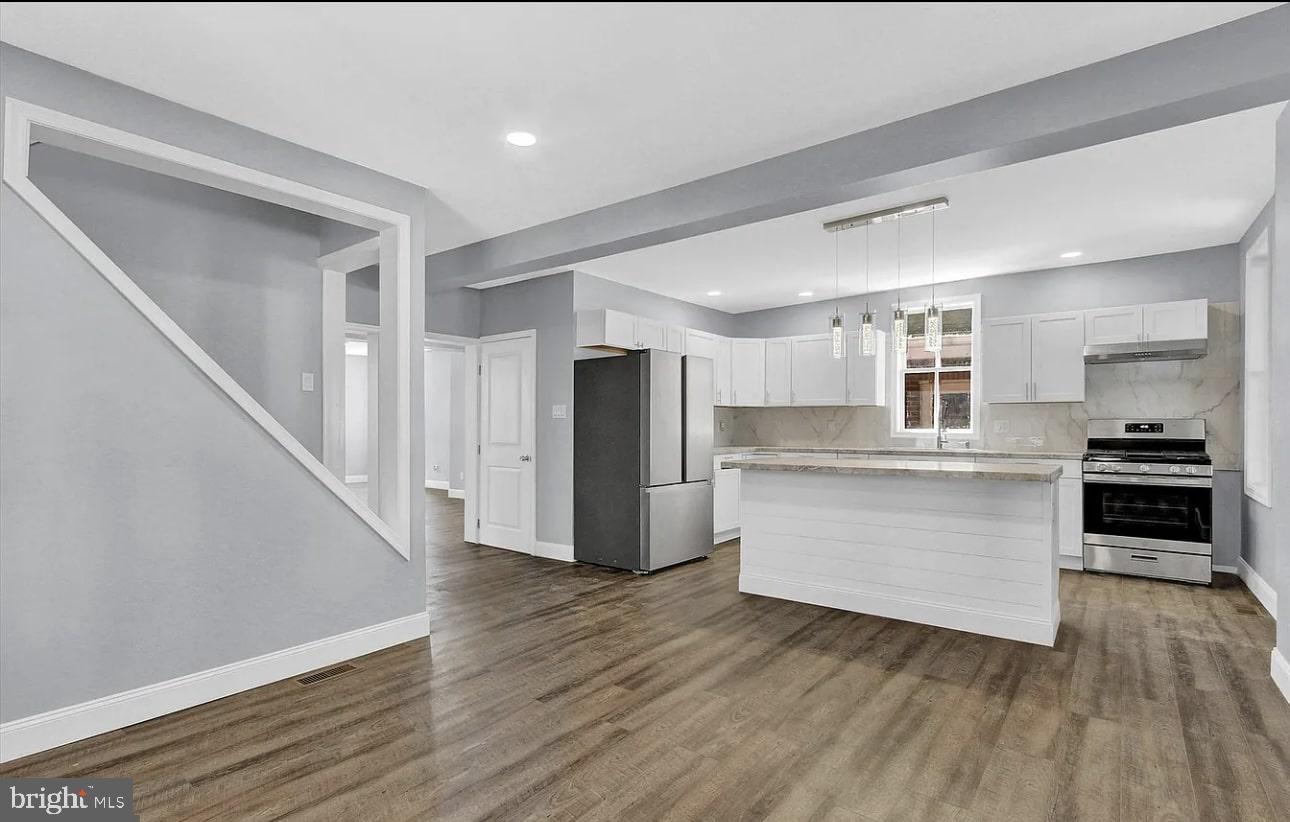 56 North Main Street Spring Grove, PA 17362 - Photo 5 of 25 a kitchen with a refrigerator and white cabinets