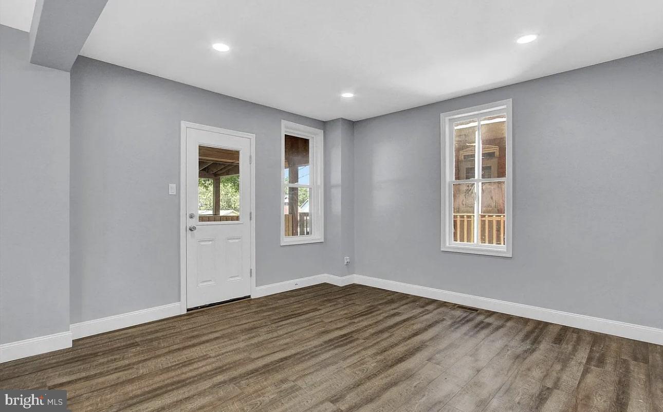 56 North Main Street Spring Grove, PA 17362 - Photo 8 of 25 a view of an empty room with wooden floor and a window