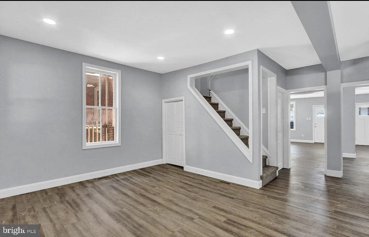56 North Main Street Spring Grove, PA 17362 - Photo 9 of 25 a view of an empty room with wooden floor and stairs