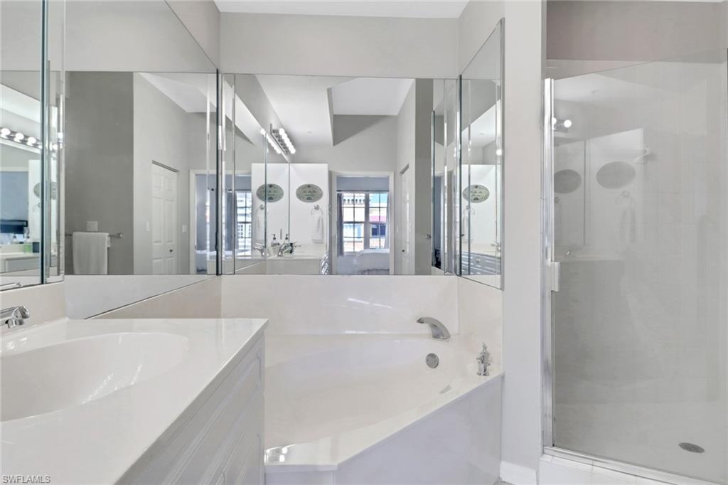 401 Bayfront Place, Unit 3502 Naples, FL 34102 - Photo 9 of 22 Full bathroom with a shower stall, a garden tub, and vanity