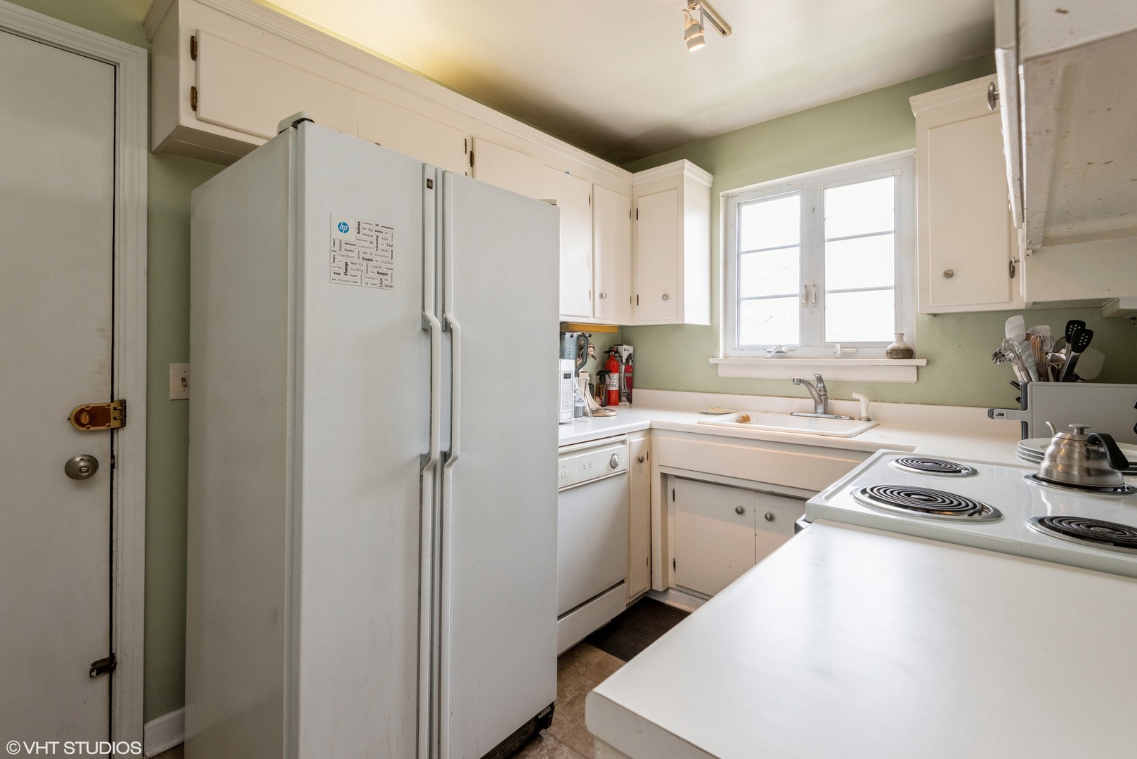 344 Ridge Avenue, Unit 3 Evanston, IL 60202 - Photo 6 of 13 a kitchen with white cabinets and white appliances