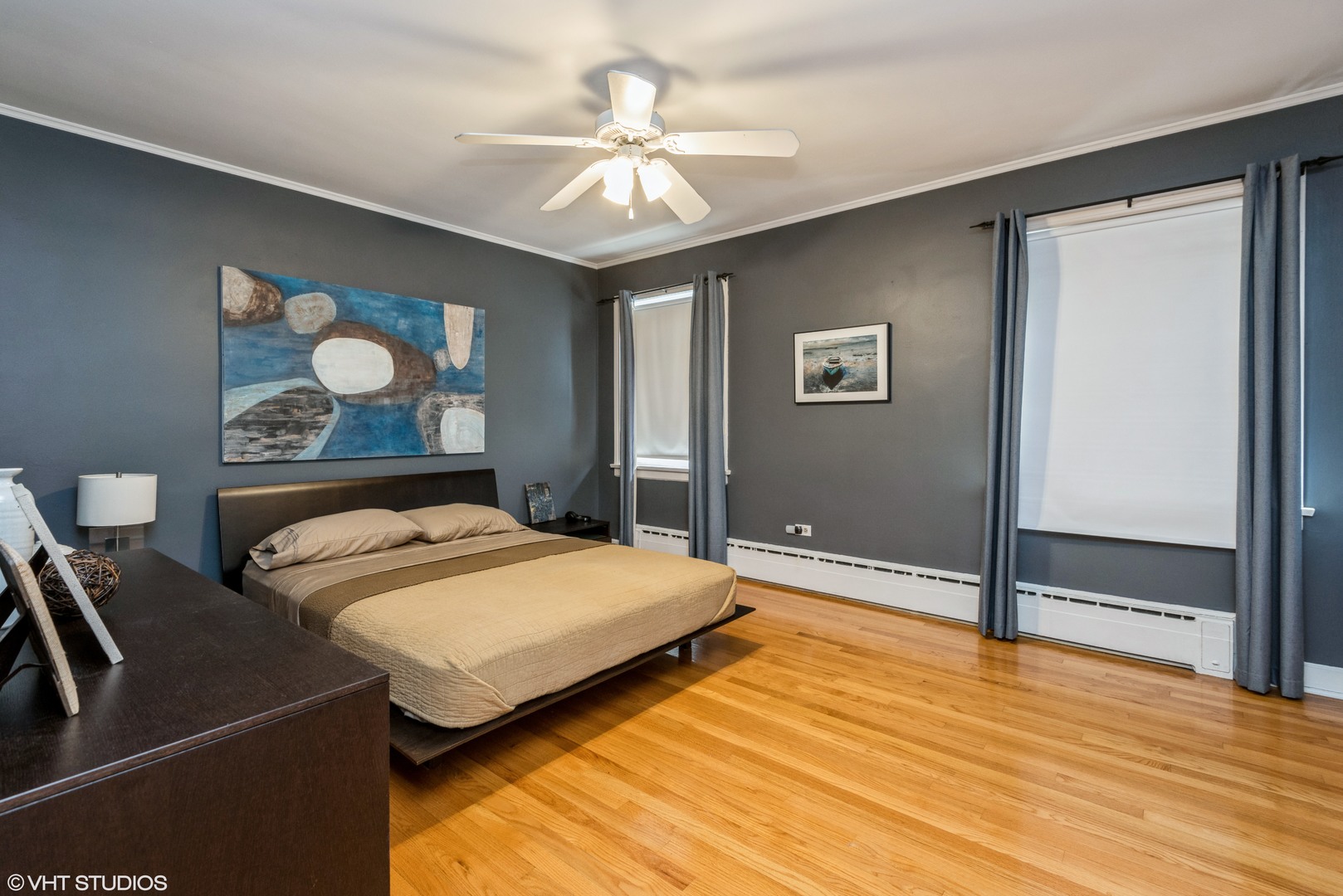 344 Ridge Avenue, Unit 3 Evanston, IL 60202 - Photo 8 of 13 a bedroom with a large bed and a chandelier