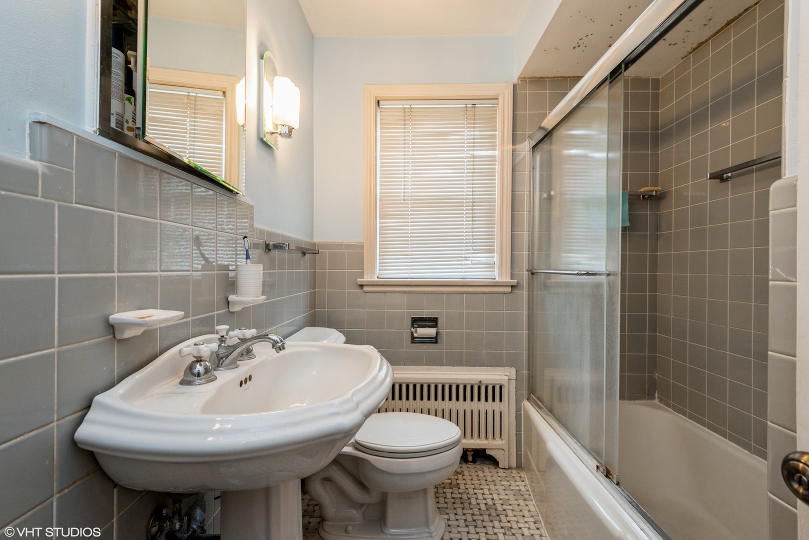 344 Ridge Avenue, Unit 3 Evanston, IL 60202 - Photo 10 of 13 a bathroom with a sink a toilet and shower